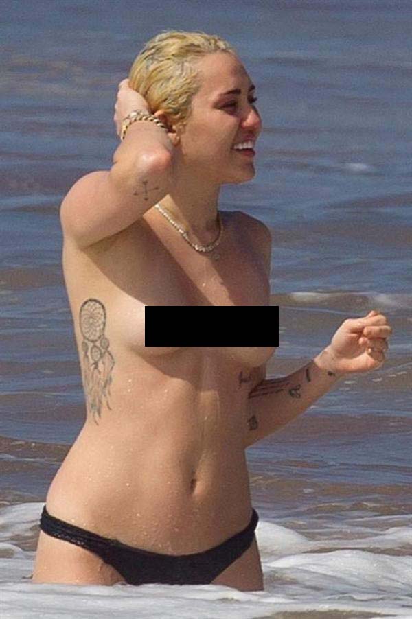 Miley Cyrus Topless at Beach in Maui